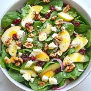 - 4 cups fresh spinach, thoroughly washed and dried - 2 medium apples (preferably Gala or Honeycrisp), cored and thinly sliced - 1 cup feta cheese, crumbled into bite-sized pieces - 1/2 cup walnuts, coarsely chopped for a delightful crunch - 1/4 cup dried cranberries, adding a touch of sweetness - 1/4 cup red onion, finely sliced for a mild sharpness - 3 tablespoons extra virgin olive oil for richness - 1 tablespoon fresh lemon juice to brighten the flavors - 1 tablespoon honey for natural sweetness - Salt and freshly ground black pepper, to taste This salad shines with fresh, simple ingredients. Spinach forms a crisp base. Apples bring a sweet crunch. Feta adds a creamy, salty touch. Walnuts provide a nice texture. Dried cranberries contribute sweetness. Red onion gives a mild bite. For the dressing, I use extra virgin olive oil for richness. Fresh lemon juice brightens each bite. Honey adds a natural sweetness. A pinch of salt and pepper rounds it all out. Together, these ingredients create a salad that is fresh, flavorful, and fun to eat! {{ingredient_image_2}} Start by washing and drying 4 cups of fresh spinach. Place it in a large mixing bowl. Next, core and thinly slice 2 medium apples. Gala or Honeycrisp apples work best for a sweet bite. Add the apple slices to the bowl. Then, crumble 1 cup of feta cheese into bite-sized pieces. Sprinkle the feta over the spinach and apples. Now, coarsely chop 1/2 cup of walnuts for crunch and mix them in. For sweetness, add 1/4 cup of dried cranberries. Finally, finely slice 1/4 cup of red onion for a mild sharpness. Toss all these fresh ingredients gently to combine. In a separate small bowl, whisk together 3 tablespoons of extra virgin olive oil, 1 tablespoon of fresh lemon juice, and 1 tablespoon of honey. This mix creates a bright and rich dressing. Add a pinch of salt and pepper for flavor. Whisk until smooth. This step is key to blending the honey with the oil and lemon. Now, drizzle the dressing over the salad ingredients. Use salad tongs or two large forks to gently toss everything together. You want to coat the ingredients well without bruising the delicate spinach leaves. Let the salad rest for about 5 minutes before serving. This time allows the flavors to meld beautifully. When ready to serve, place the salad in individual bowls. For extra texture, garnish with additional walnuts or cranberries. This makes the salad even more appealing. Enjoy the fresh and vibrant flavors! - Alternatives for apples: If you want a different taste, try pears or oranges. Both fruits offer a sweet flavor and a nice crunch. You can even use berries for a unique twist. - Vegan options for feta cheese: If you want a plant-based option, use tofu or cashew cheese. These alternatives mimic the creamy texture of feta and blend well with the salad. - Serving bowl options: A clear glass bowl shows off the colorful layers of the salad. You can also use wooden bowls for a rustic look. - Garnishing techniques: Sprinkle extra walnuts or cranberries on top for added color and texture. Fresh herbs like parsley or mint can also enhance the visual appeal. - Tips for perfect seasoning: Start with a pinch of salt and pepper. Taste your salad and add more if needed. The right balance makes all the flavors pop. - Importance of resting time: Let the salad sit for about 5 minutes before serving. This allows the dressing to soak into the spinach and fruits, making every bite more delicious. Pro Tips Choose the Right Apples: For the best flavor combination, opt for sweet and crisp varieties like Gala or Honeycrisp, which complement the salty feta perfectly. Toast the Walnuts: Lightly toasting the walnuts enhances their flavor and adds an extra layer of crunch to the salad. Make Ahead Tips: Prepare the salad components in advance but keep the dressing separate until serving to maintain the freshness of the spinach. Vary the Cheese: Experiment with different cheeses like goat cheese or blue cheese for a unique twist on this classic salad. {{image_4}} You can change the apples for other fruits. Pears add a sweet crunch. Oranges give a bright, citrus flavor. Strawberries bring a juicy pop and vibrant color. Each fruit gives a new twist to your salad. To make the salad more filling, add protein. Grilled chicken works well and adds a savory touch. Chickpeas are a great plant-based option. They add texture and keep the dish light and fresh. Consider seasonal changes when you make this salad. In winter, add roasted root veggies for warmth. In summer, try fresh berries for brightness. Each season brings new flavors to explore in your salad. To store leftovers of your Apple Feta Spinach Salad, place it in an airtight container. This keeps the salad fresh and prevents any strong odors from the fridge. If you have leftovers, store them within two hours of making the salad. This helps keep the ingredients safe to eat. Avoid mixing the dressing with the salad until you are ready to eat. This keeps the spinach crisp and fresh. If your spinach looks wilted, you can refresh it easily. First, run cold water over the spinach for a minute. Drain it well, then gently pat it dry with a clean towel. You can also soak the spinach in cold water for about 10 minutes. This helps it regain its shape. After that, toss it lightly to separate the leaves. The salad lasts about three days in the fridge. However, the spinach may lose its crunch after the first day. The apples can also brown, so it's best to eat the salad soon. If you want to keep it fresh longer, store the apples separately and add them right before serving. Yes, you can prepare parts of the salad ahead of time. Wash and dry the spinach first. Slice the apples and store them in lemon juice to keep them fresh. Crumble the feta and chop the walnuts too. Combine everything just before serving for the best taste. To keep spinach fresh, store it dry in the fridge. Use a clean paper towel to absorb moisture. If you dress the salad too early, the spinach will wilt. Dress it right before you eat for a crisp salad. Gala and Honeycrisp apples are great choices. They add sweetness and crunch. You can also try Granny Smith for a tart flavor. Choose apples that are firm and fresh. This salad is naturally gluten-free. Just check the labels on your ingredients. Ensure your honey and any processed items are gluten-free. Enjoy this salad without worries! This blog post covered a delicious spinach salad packed with fresh ingredients and flavor. You learned about how to prepare each component, make a tasty dressing, and assemble the dish. We also discussed seasoning tips, ingredient swaps, and storage advice. In my experience, simple salads can be both nutritious and satisfying. By mixing and matching ingredients, you can create your own unique version. Keep exploring flavors, and enjoy your creations!